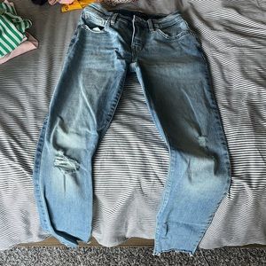 Womens jeans. Bought with distressing on fronts and on bottoms.